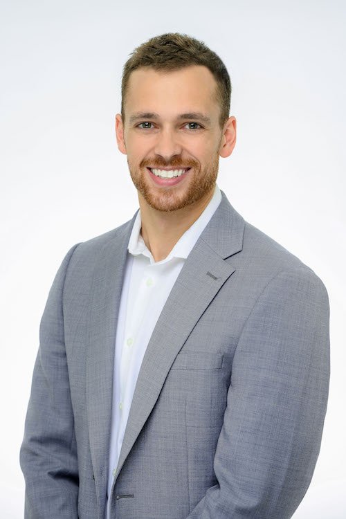Nick Rybinski in a gray blazer